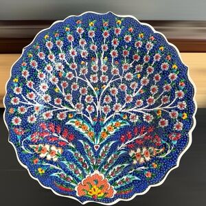Vibrant Floral Ceramic Plate with Blue and Red Accents
